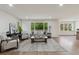 Spacious and inviting living room featuring hardwood floors, and bright windows at 7309 Windsor Dr, Boulder, CO 80301
