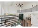 Bright open concept living and dining area with vaulted ceilings and modern staircase at 7309 Windsor Dr, Boulder, CO 80301