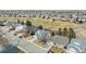 Neighborhood aerial view showcasing the landscape, nearby golf course, and houses at 664 Clarendon Dr, Longmont, CO 80504