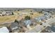 Beautiful neighborhood homes adjacent to a lovely golf course with a pond, providing scenic views and recreation at 664 Clarendon Dr, Longmont, CO 80504