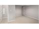 Neutral basement with a doorway, carpeted floor, and neutral paint creating a flexible living space at 664 Clarendon Dr, Longmont, CO 80504