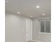 Finished basement with neutral walls and floor, a door and a window at 664 Clarendon Dr, Longmont, CO 80504