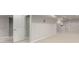 Spacious basement with neutral walls, neutral carpet, and white trim and doors at 664 Clarendon Dr, Longmont, CO 80504
