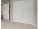 Bedroom featuring carpeted floors, closet space and neutral color palette for a calming ambiance at 664 Clarendon Dr, Longmont, CO 80504