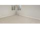 Bright bedroom with a window view and neutral colored walls and carpet at 664 Clarendon Dr, Longmont, CO 80504