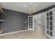 Dining room featuring modern light fixtures, wood floors, and open entryway at 664 Clarendon Dr, Longmont, CO 80504