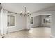 Open floor plan dining area featuring modern lighting and light hardwood floors at 664 Clarendon Dr, Longmont, CO 80504