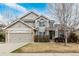 Charming home with a two-car garage, stone accents, and well-maintained landscaping at 664 Clarendon Dr, Longmont, CO 80504