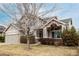 Attractive two-story home featuring a two-car garage and mature landscaping at 664 Clarendon Dr, Longmont, CO 80504