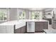 Bright eat-in kitchen with stone countertops, stainless steel appliances, and a large kitchen island at 664 Clarendon Dr, Longmont, CO 80504