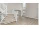 Spacious living room showcasing high ceilings, staircase, and modern flooring at 664 Clarendon Dr, Longmont, CO 80504