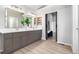 Main bathroom boasts dual vanities, granite countertop, and modern fixtures at 664 Clarendon Dr, Longmont, CO 80504