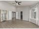 Spacious main bedroom featuring walk-in closet, large windows, and neutral flooring at 664 Clarendon Dr, Longmont, CO 80504