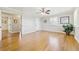 Bright bedroom featuring hardwood floors, ceiling fan, and white trim at 7867 S Poplar Way, Centennial, CO 80112