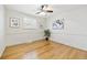 Bright and airy bedroom with hardwood floors, wainscoting, and contemporary artwork at 7867 S Poplar Way, Centennial, CO 80112