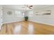 Spacious bedroom with hardwood floors, ceiling fan, and natural light from two windows at 7867 S Poplar Way, Centennial, CO 80112