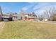 Inviting two-story home with a well-manicured front lawn and attached garage at 7867 S Poplar Way, Centennial, CO 80112