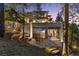 Backyard patio with stone and an outdoor table for relaxing and dining at 22419 Springflower Dr, Golden, CO 80401