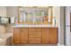 Bathroom vanity with double sinks, large mirror, and decorative tile work at 22419 Springflower Dr, Golden, CO 80401