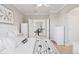 This bedroom has an ensuite and neutral colors with a ceiling fan and natural light at 22419 Springflower Dr, Golden, CO 80401