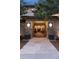 Elegant front entrance showcasing stone accents and open doorway with bright interior at 22419 Springflower Dr, Golden, CO 80401