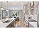 Bright kitchen showcases white cabinets, stainless appliances, and hardwood floors at 22419 Springflower Dr, Golden, CO 80401