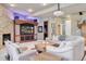 This living room has a fireplace, built in entertainment system, and a projector at 22419 Springflower Dr, Golden, CO 80401