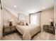 Cozy bedroom featuring a queen-size bed flanked by matching nightstands and neutral decor at 350 Vista Cliff Cir, Castle Rock, CO 80104