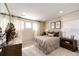 Comfortable bedroom with ample natural light, decorative accents, and plush carpet, inviting and serene at 350 Vista Cliff Cir, Castle Rock, CO 80104