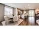 Bright dining area open to the kitchen, featuring hardwood floors and ample seating at 350 Vista Cliff Cir, Castle Rock, CO 80104