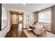 Inviting dining area featuring hardwood floors, natural light, and stylish furnishings at 350 Vista Cliff Cir, Castle Rock, CO 80104