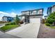 Two-story home with a well-maintained lawn, complemented by fresh landscaping and an attached garage at 350 Vista Cliff Cir, Castle Rock, CO 80104