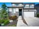 Charming two-story home with a beautiful stone accent, an attached two-car garage and landscaped front yard at 350 Vista Cliff Cir, Castle Rock, CO 80104