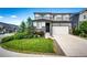 Charming two-story home featuring a well-manicured front yard and attached two car garage at 350 Vista Cliff Cir, Castle Rock, CO 80104