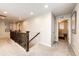 Upstairs hallway with neutral carpet, dark wood trim, and recessed lighting leading to various rooms at 350 Vista Cliff Cir, Castle Rock, CO 80104
