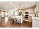 Bright kitchen featuring an island with seating, stainless steel appliances, and open concept design at 350 Vista Cliff Cir, Castle Rock, CO 80104