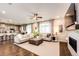 Open-concept living room with kitchen, dining area and fireplace at 350 Vista Cliff Cir, Castle Rock, CO 80104