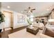 Open-concept living room flows into kitchen with lots of natural light and space for entertaining at 350 Vista Cliff Cir, Castle Rock, CO 80104