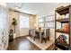 Cozy home office with dark wood floors, natural light, and minimalist decor at 350 Vista Cliff Cir, Castle Rock, CO 80104