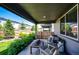 Inviting covered patio area with comfortable seating, perfect for outdoor relaxation and entertaining at 350 Vista Cliff Cir, Castle Rock, CO 80104