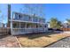 A spacious backyard featuring a covered porch and a well-maintained lawn that enhances outdoor enjoyment at 1109 E 7Th Avenue Cir, Broomfield, CO 80020