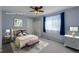 Staged bedroom showcasing tasteful furniture, a ceiling fan, and a sunny window with pleasant accents at 1109 E 7Th Avenue Cir, Broomfield, CO 80020