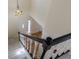 Foyer with stairs, chandelier, and front door entry to the living space at 1109 E 7Th Avenue Cir, Broomfield, CO 80020