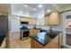 Charming kitchen featuring stainless steel appliances, island, and plenty of natural light at 1109 E 7Th Avenue Cir, Broomfield, CO 80020