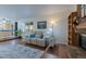 Inviting living room with a brick fireplace, comfortable seating, and ample natural light at 1109 E 7Th Avenue Cir, Broomfield, CO 80020