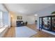 Bright living room with hardwood floors, a large window, and cozy seating, creating a comfortable atmosphere at 1109 E 7Th Avenue Cir, Broomfield, CO 80020