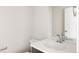 Modern bathroom featuring a sleek countertop, stylish fixtures, and a large mirror at 6068 Beeler Ct, Denver, CO 80238