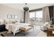 Bright main bedroom with a private balcony featuring neutral decor and ample natural light at 6068 Beeler Ct, Denver, CO 80238