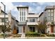 Striking contemporary home featuring a two-story facade and professionally landscaped front yard at 6068 Beeler Ct, Denver, CO 80238