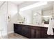 Sleek bathroom featuring a large vanity, modern fixtures, and contemporary design at 6068 Beeler Ct, Denver, CO 80238